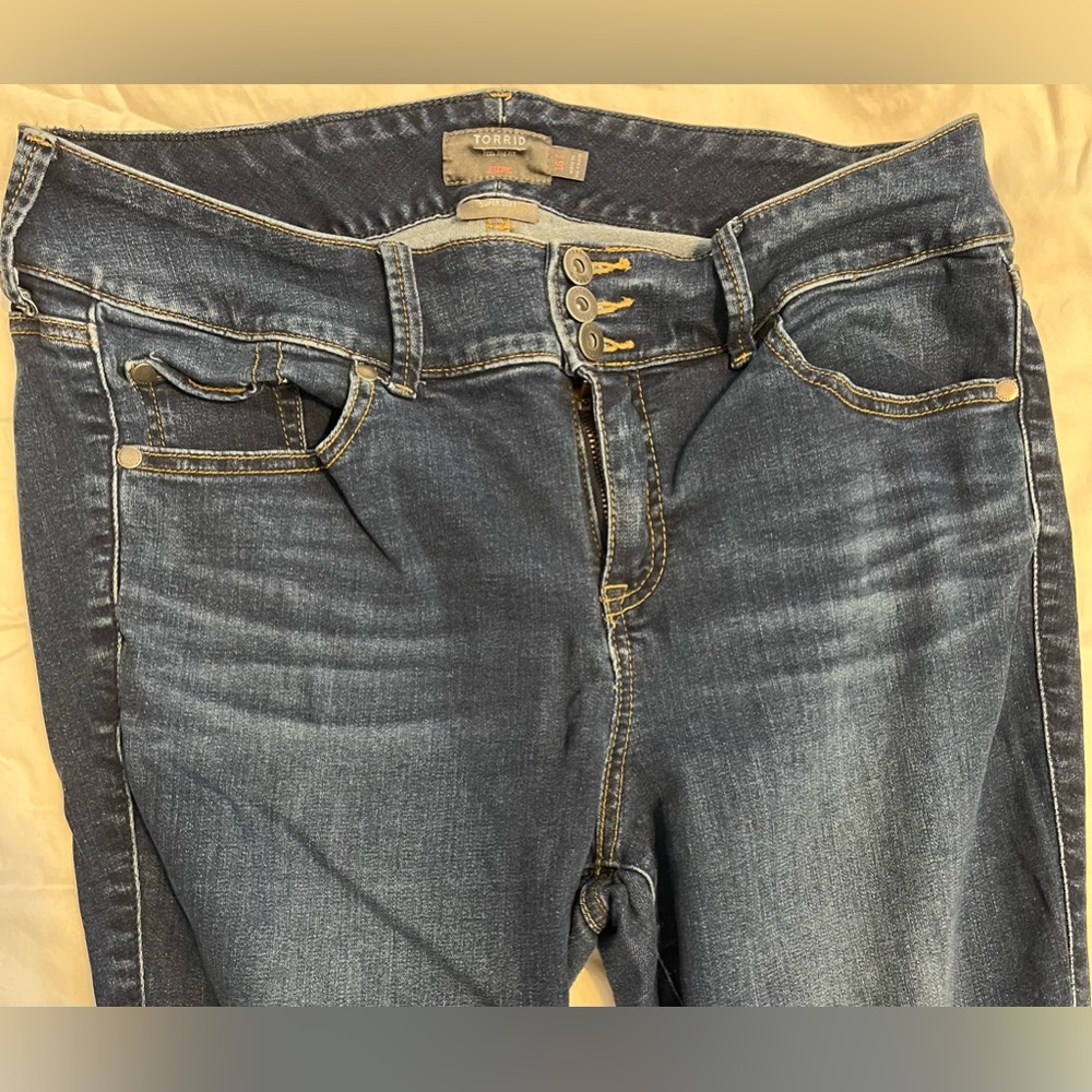 Torrid Skinny Jeggings with distressed hem.